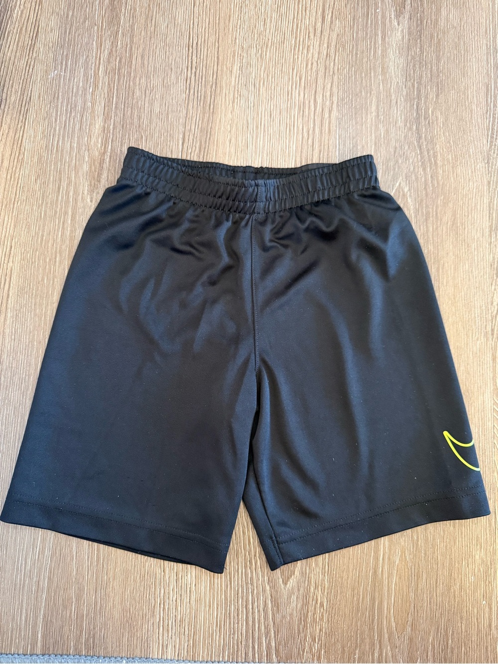 Boys Nike Black Athletic Shorts with Yellow Swoosh - size 6 (M)